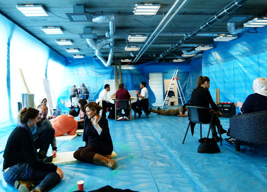 Students in the blue space on their first day of work.