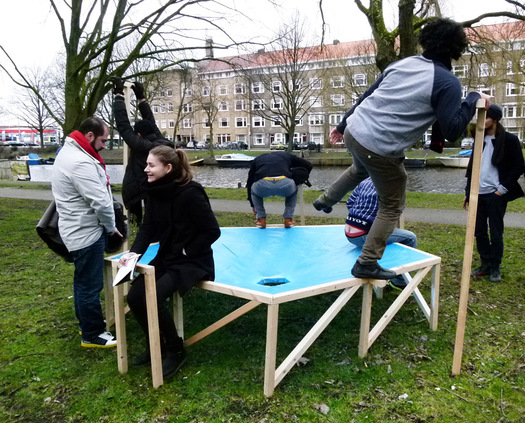 A group of students demonstrate their design for Extra National toilet.