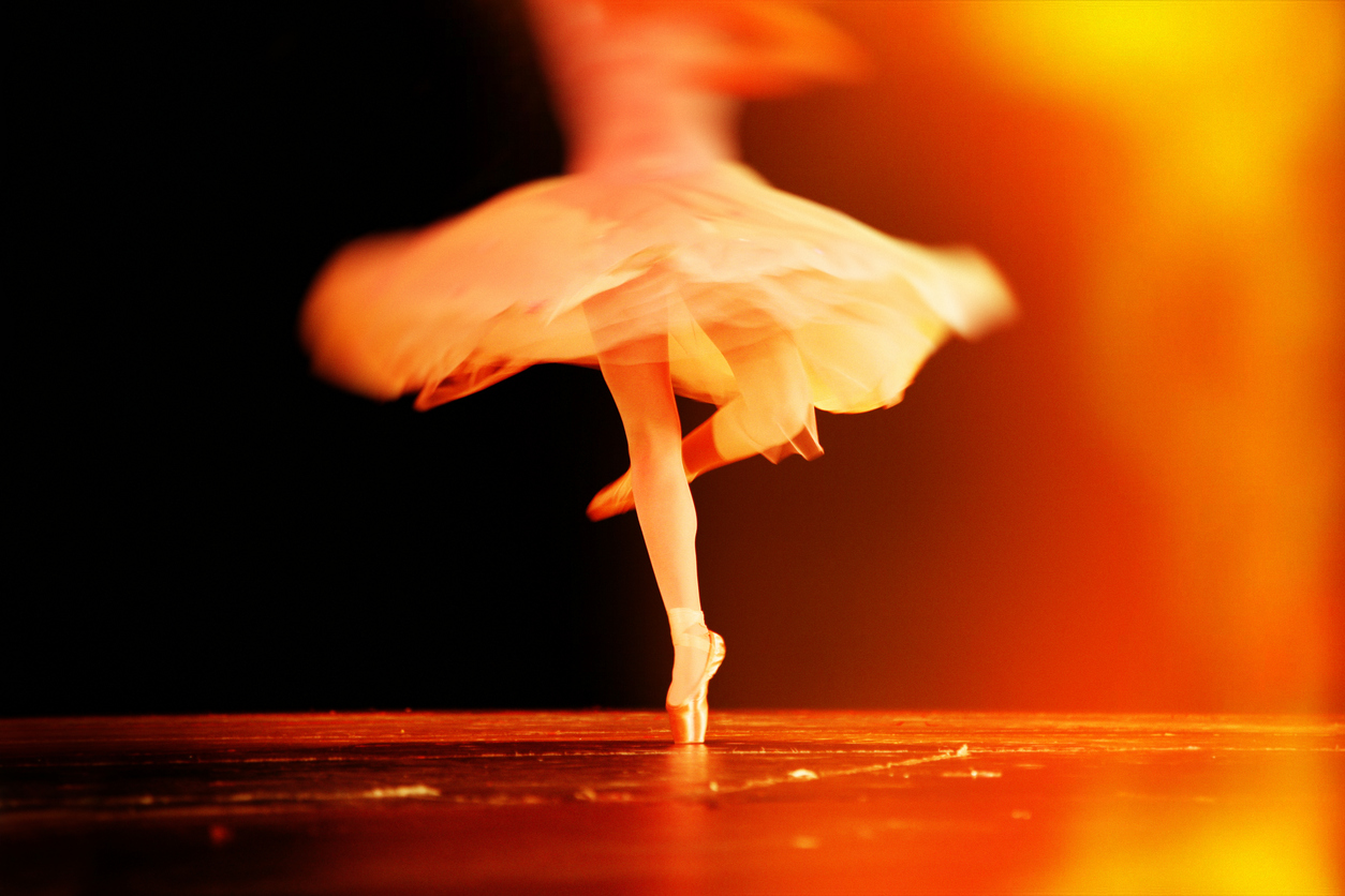 Spinning ballerina with motion blur during ballet performance