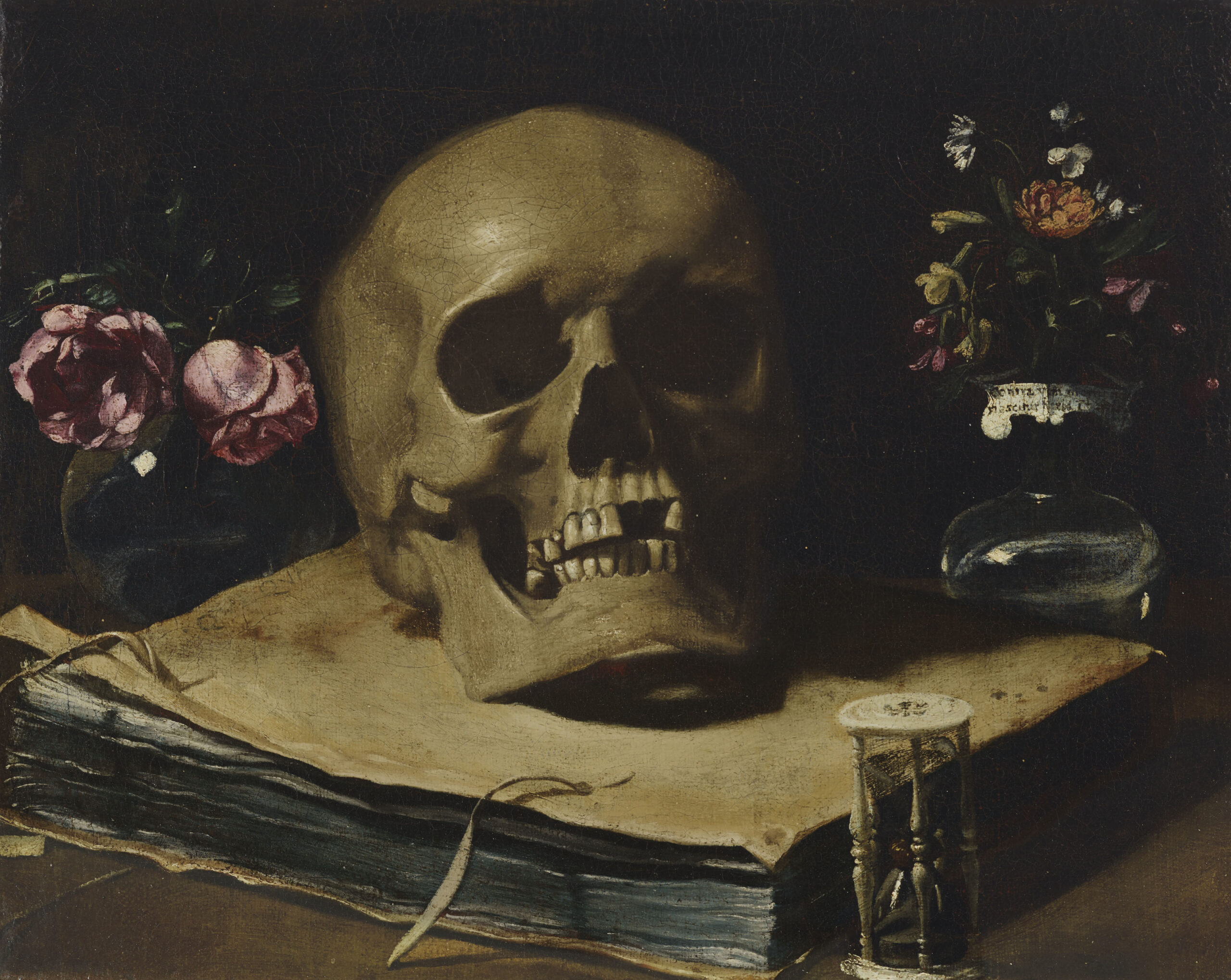 Guercino_-_A_vanitas_still_life_with_a_skull_atop_a_book,_an_hourglass_and_two_glass_vases_of_flowers