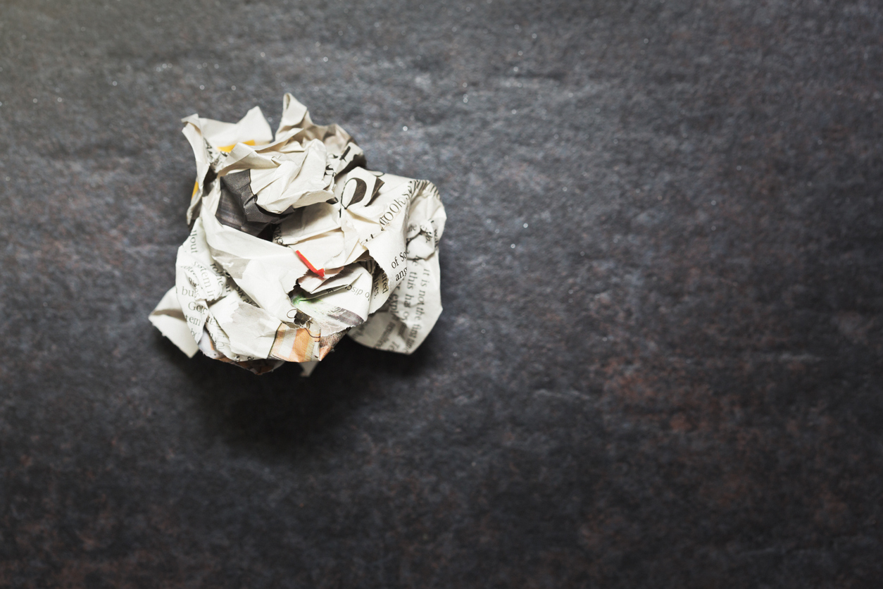 Crumpled ball of discarded newspaper
